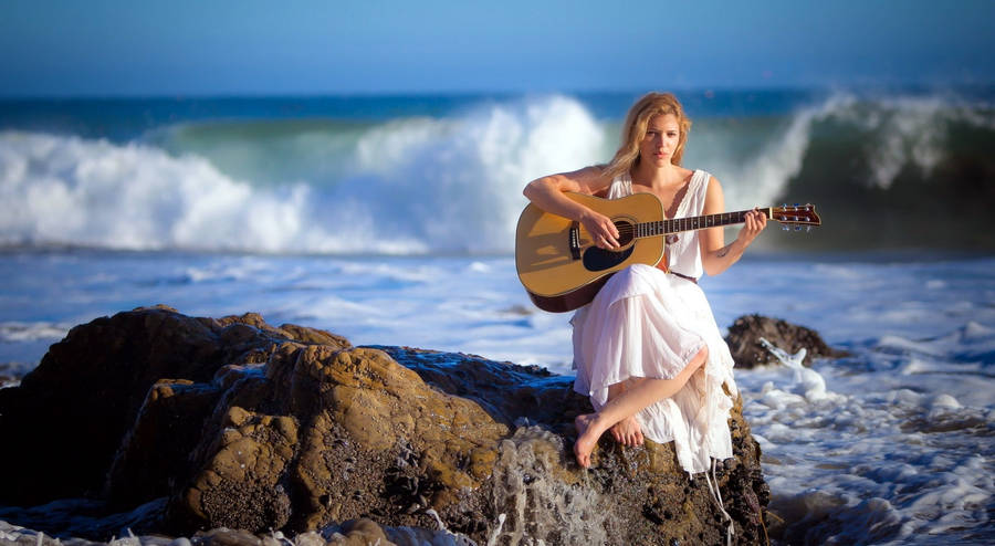 Woman Beach Playing Guitar Wallpaper