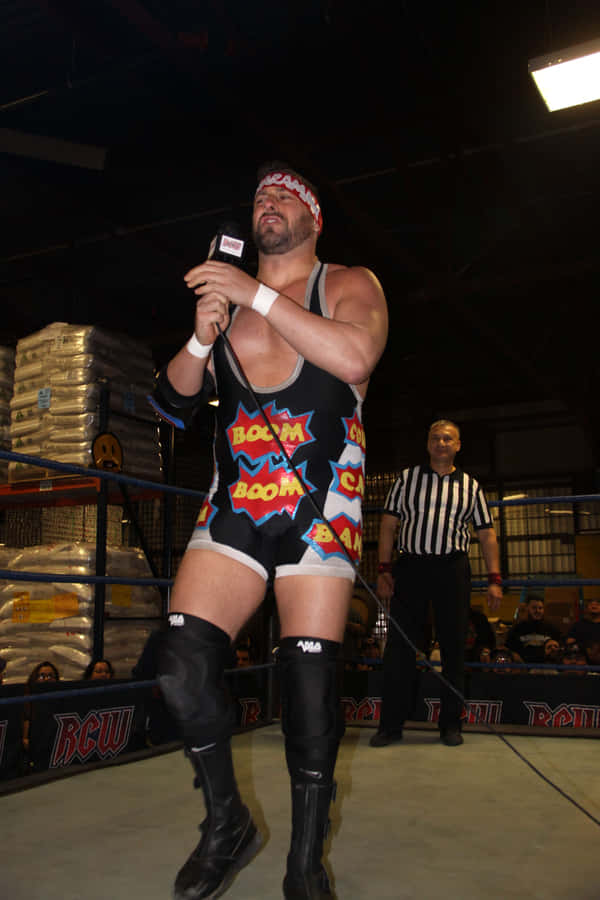 Wrestler_with_ Microphone_in_ Ring.jpg Wallpaper