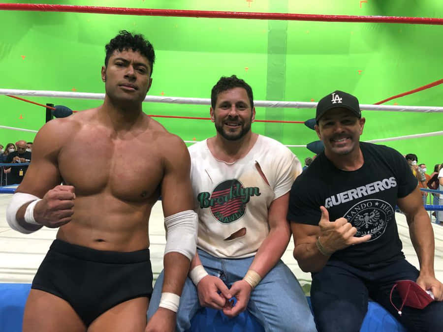 Wrestlers Posingin Ring Side Area Wallpaper