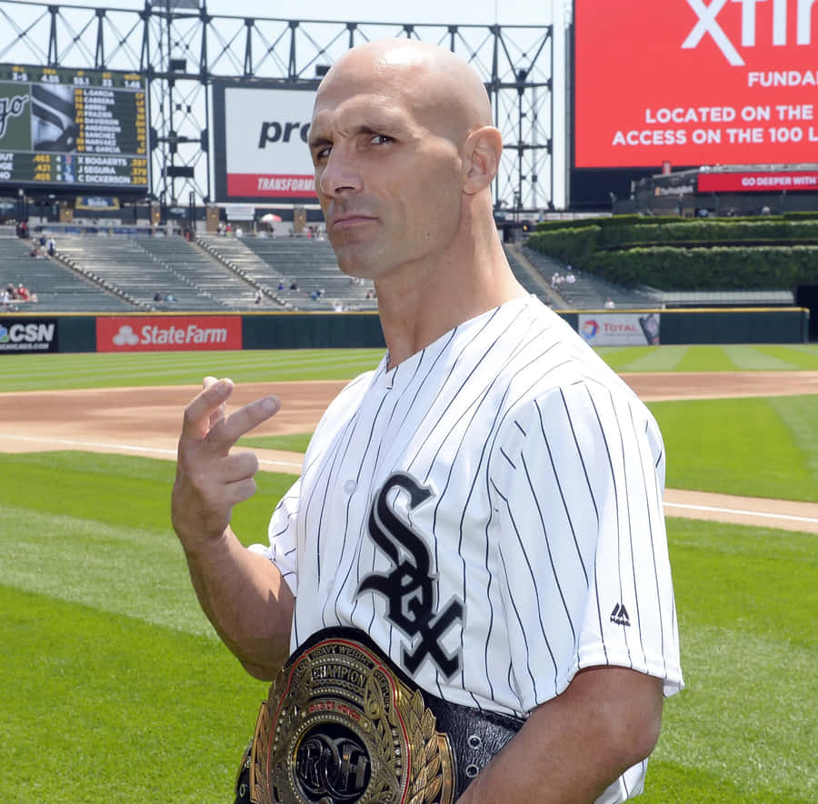 Wrestlerwith Championship Beltat Baseball Field Wallpaper