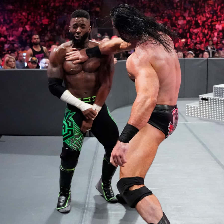 Wrestling Showdown: Cedric Alexander Vs. Drew Mcintyre In Wwe Wallpaper