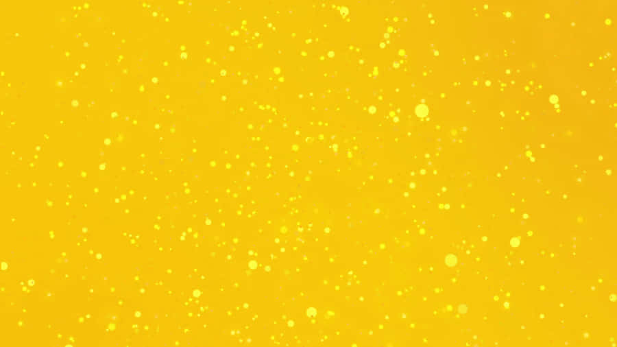 Yellow Background With Drops Of Water Wallpaper