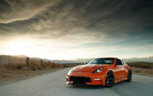 1. A Sporty Nissan 370z On The Road Wallpaper