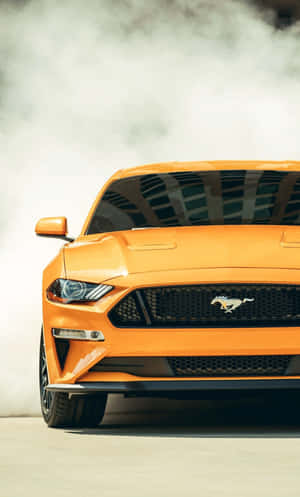 2019 Ford Mustang Performing A Burnout On The Road. Wallpaper