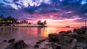 2560 X 1440 Sunset By Rocky Seaside Wallpaper