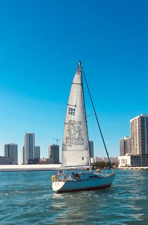 4k Beach With Sailing Boat Wallpaper