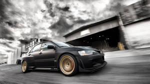 4k Jdm Mitsubishi Under Stormy Sky Wallpaper