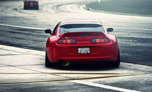 4k Jdm Red Toyota Supra On Road Wallpaper