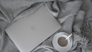 4k Laptop Laptop On Duvet Wallpaper