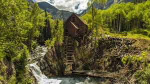 8k Desktop Cabin In A Forest Wallpaper