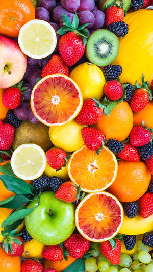 8k Iphone Vibrant Sliced Fruits Wallpaper