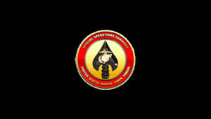 A Badge With A Red And Yellow Emblem On It Wallpaper