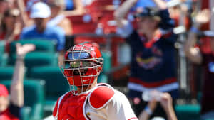 A Baseball Player Is Standing In Front Of A Crowd Wallpaper