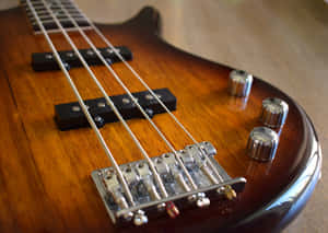 A Bass Guitar To Strum Up Some Cool Beats. Wallpaper