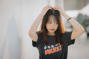 A Beautiful Asian Girl Posed For The Camera Wallpaper