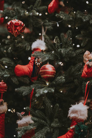 A Beautiful Christmas Tree Decorated With Ornamental Balls. Wallpaper