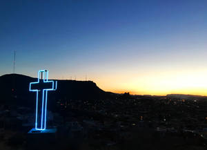 A Beautiful Ornate Cross In A Serene Background Wallpaper