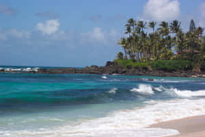 A Beautiful Sunrise Over The Picturesque Beach In Hawaii Wallpaper