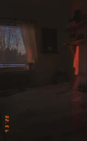 A Bed With A Blanket On It Wallpaper