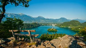 A Bench At The Mountain Peak Overlooking Lake Bled Wallpaper