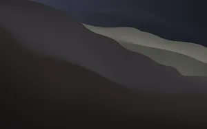 A Black And White Image Of A Mountain Wallpaper