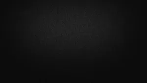 A Black Background With A Light Shining On It Wallpaper