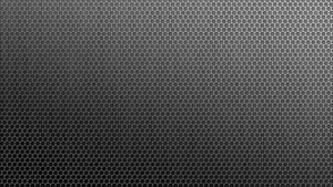 A Black Background With A Pattern Of Hexagons Wallpaper