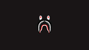 A Black Background With A Red Shark Face Wallpaper