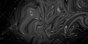 A Black Marble Surface Reflecting Light Wallpaper