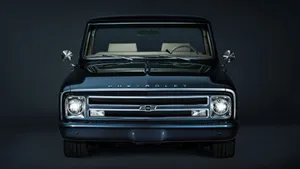 A Black Truck With A Black Front End Wallpaper