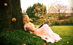 A Blonde Girl Enjoying Spring Wallpaper