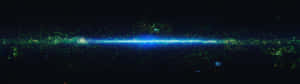 A Blue And Green Galaxy In Space Wallpaper
