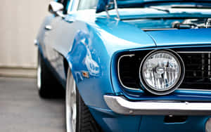 A Blue Muscle Car With The Hood Open Wallpaper
