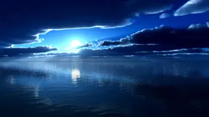 A Blue Sky With Clouds And Water Wallpaper
