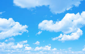 A Blue Sky With White Clouds Wallpaper