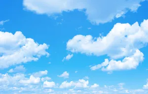 A Blue Sky With White Clouds Wallpaper