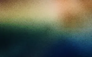 A Blurry Background With A Colorful Pattern Wallpaper