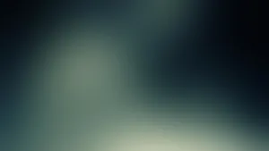 A Blurry Image Of A Green And Blue Sky Wallpaper