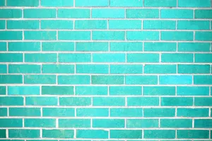 A Brick Wall With A Turquoise Color Wallpaper