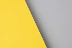 A Bright Gray And Yellow Background Wallpaper