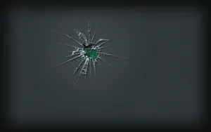 A Broken Glass With A Green Shard Wallpaper