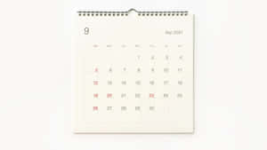 A Calendar With A White Background And A Red Number Wallpaper