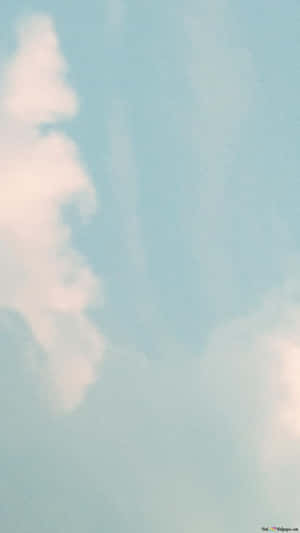 A Calming Landscape Of A Rolling Grassy Valley Dotted With Trees And Mountains, With A Cloudy Aesthetic Wallpaper