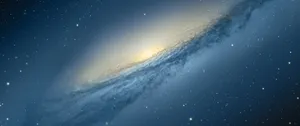 A Captivating View Of A Soft White And Blue Galactic Sky. Wallpaper