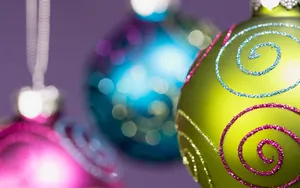 A Christmas Ornament Adorns The Holiday Season With Festive Colors Wallpaper