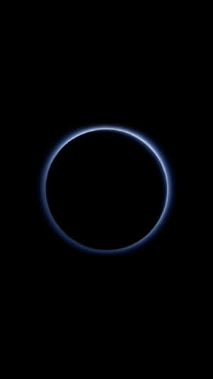 A Circle Of Light Is Seen In The Dark Wallpaper