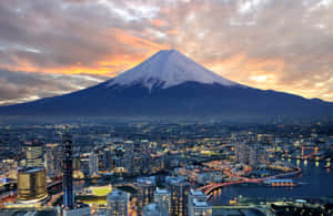 A City And Mountain At Dusk Wallpaper