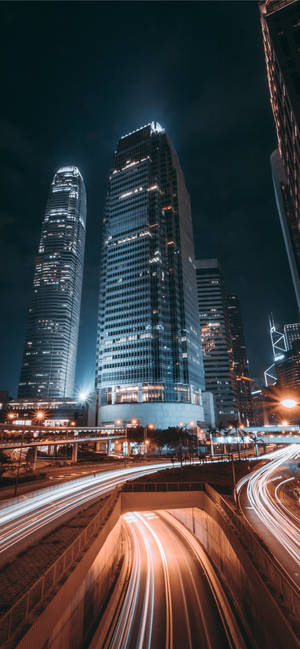 A City At Night With Light Trails Wallpaper