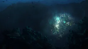 A City In The Ocean With A Glowing Light Wallpaper