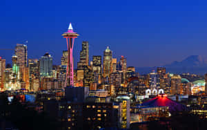 A City Skyline With A Mountain In The Background Wallpaper